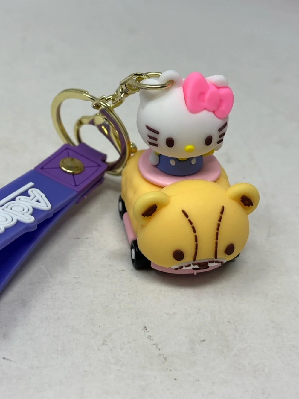 HELLO KITTY BUNDLE 7 -BEANIE, 2 KEYCHAIN, CRÈME SHOP BATH BOMB LIP BALM, CHARM
